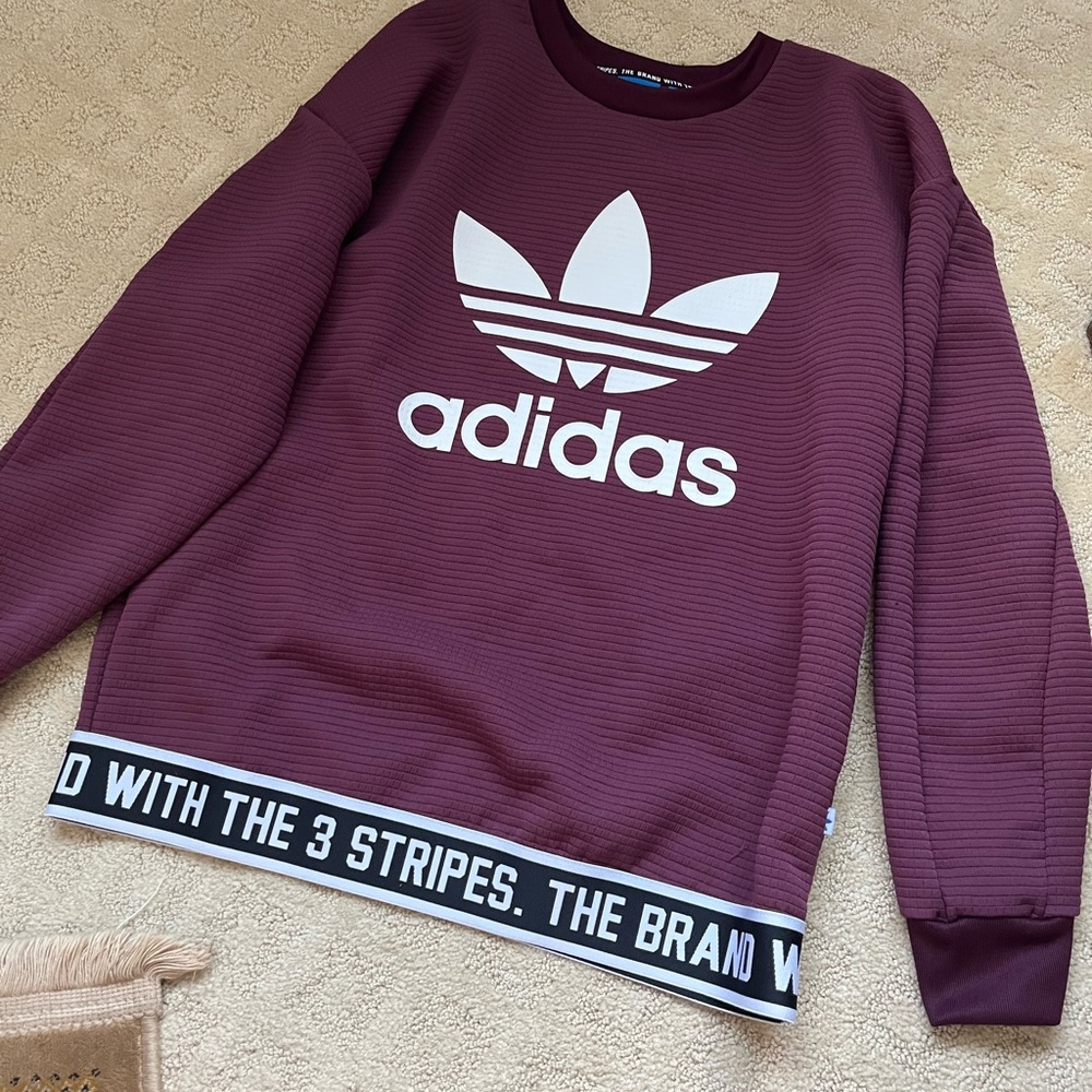 maroon colored Adidas sweatshirt.  Never been worn, although no tags   xs